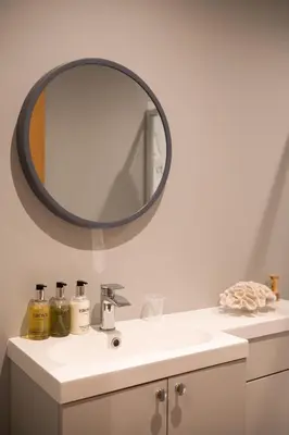 a bathroom with a sink and a mirror at Beechwood in Oban