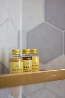 three jars of honey sitting on a shelf at Escape to Serene Georgian Estate, near Edinburgh in Ratho