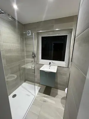 a bathroom with a shower and a sink and a window at LUXERY 1 Bedroom Apartment - Falkirk in Falkirk