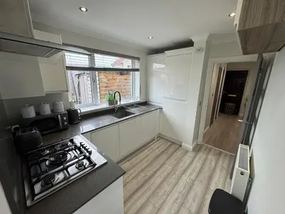 a kitchen with a stove and a counter top at LUXERY 1 Bedroom Apartment - Falkirk in Falkirk