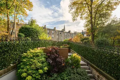 a garden in front of a building at Elegant Flat with Garden in Edinburgh West End in Edinburgh