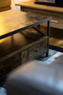 a wooden coffee table with a wooden top at Sauchihall Apartment in Glasgow