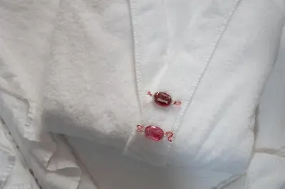 a white shirt with two red roses on it at Sauchihall Apartment in Glasgow