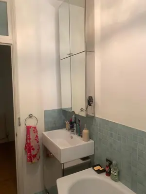 a bathroom with a sink and a mirror at Elegant, Cozy 1 Bedroom Flat In Heart Of London Pimlico in Moffat