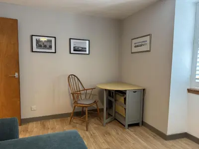 a room with a desk and a chair and a table at Watt-A-View in Limekilns