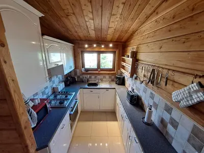 an overhead view of a kitchen with a wooden ceiling at 87 Loch Murray in Creetown
