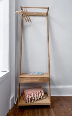 a wooden shelf with a pillow on a wooden floor at Stirling Retreat Quirky Decor, Fireplace and Charm in Stirling
