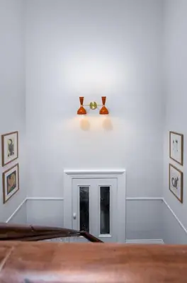 a room with a white wall with a fireplace at Stirling Retreat Quirky Decor, Fireplace and Charm in Stirling
