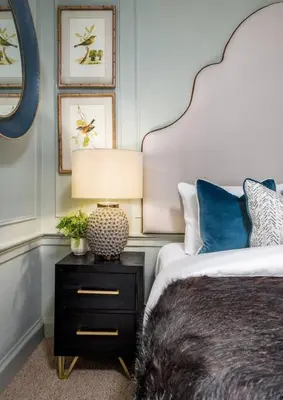 a bedroom with a bed and a lamp on a night stand at The Allan Maisonette Charming Georgian Retreat in Stirling