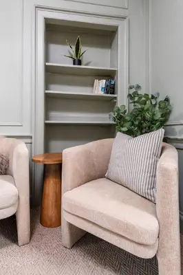 a living room with a chair and a table at The Allan Maisonette Charming Georgian Retreat in Stirling