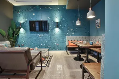 a dining room with tables and a tv on a wall at For Students Only - Kings Stables Road in Edinburgh in Edinburgh