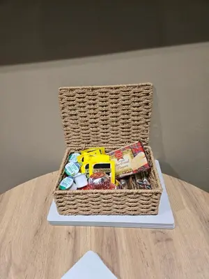 a basket filled with toys on top of a table at The Tearoom Tarbet in Tarbet