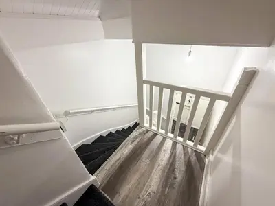 a stairway in a room with a stair case at Glasgow Home Newly Refurbished in Glasgow