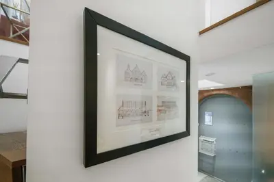 a framed picture hanging on a wall in a room at Unique 1 Bedroom Near West End in Glasgow
