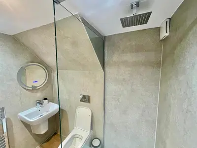 a bathroom with a toilet and a sink at Three bedroom Apartment In Glasgow City Centre in Glasgow