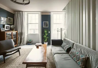 a living room with a couch and a coffee table at Shipmaster's Townhouse in Queensferry