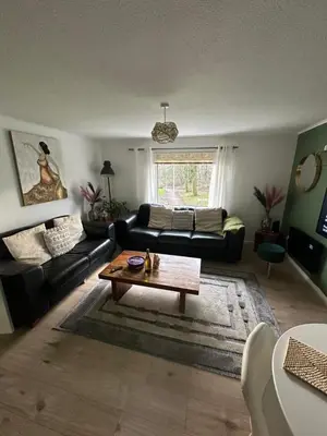 a living room with a couch and a coffee table at 3 bedroom apartment in Cumbernauld