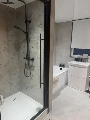 a bathroom with a shower and a sink at Stylish modern flat in the centre of Dunfermline in Dunfermline
