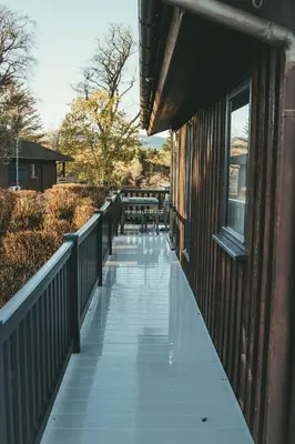 a walkway on the side of a building at Highland Coo Lodge in Dunoon