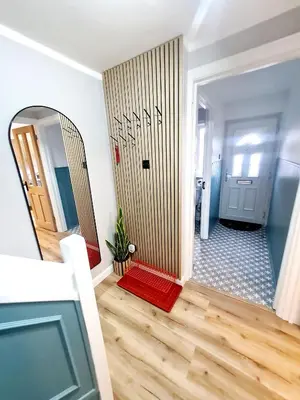 a hallway with a mirror and a door in a room at Urban 4BR house - Central-FREE parking-NO PARTY in Glasgow
