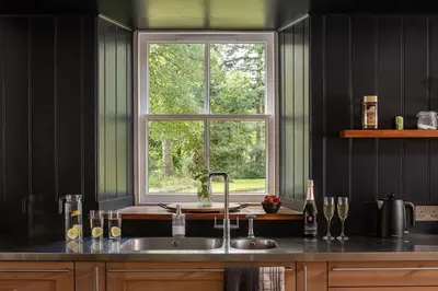 a kitchen with a sink and a window at Quarter House in Peebles