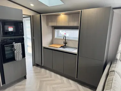 a kitchen with a sink and a stove at Lime Tree Lodge in Crieff