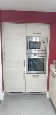 a kitchen with white cabinets and an oven at Oatlands Oasis-FREE PARKING-2 Minutes from M74 in Glasgow
