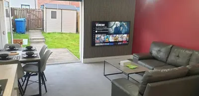 a living room with a couch and a table at Oatlands Oasis-FREE PARKING-2 Minutes from M74 in Glasgow