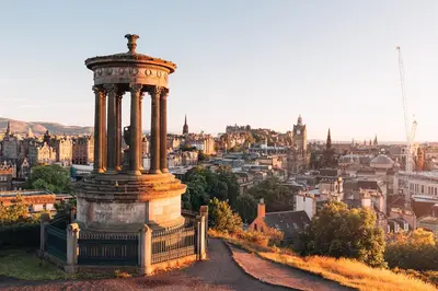 a large monument on a hill with a view of a city at Hutchison apartments in Edinburgh