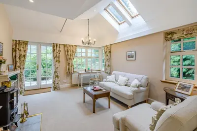 a living room with a couch and a table at 3 Bed in Comrie oc-e33307 in Comrie