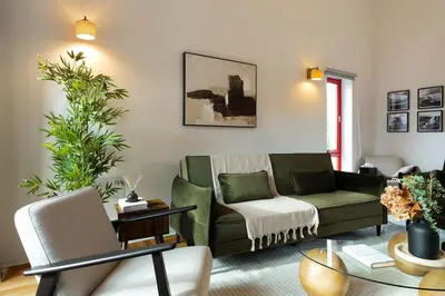 a living room with a couch and a table at Botanic House - 3BR Home - Private Parking in Glasgow