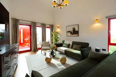 a living room with a couch and a table at Botanic House - 3BR Home - Private Parking in Glasgow
