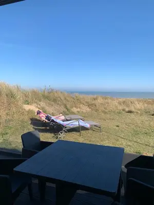 a small plane on the beach with a table and chairs at The Beach House in Moffat