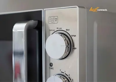 a close up of a microwave with a knob at 2 Bed Sleeps 4 with Private Parking in Airdrie in Airdrie
