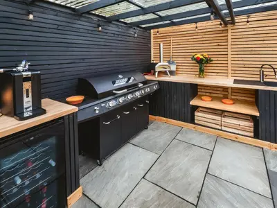 a outdoor kitchen with a stove and a sink at Islay - Uk48416 in Dalry
