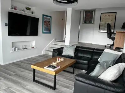 a living room with a couch and a coffee table at City Centre Apartment in Glasgow