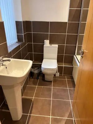 a bathroom with a toilet and a sink at Thistle Tide 13 Nelson Street Largs KA308LN 1st Floor in Largs