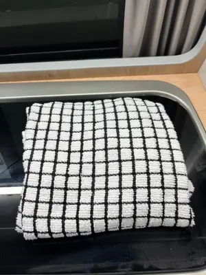 a black and white checkered towel sitting on a table at Campervan Scotland, Glen Roamer in Braco