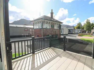 a balcony with a gazebo on a house at Altair Lodge in Crieff