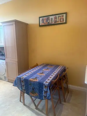 a table with a table cloth on it in a kitchen at Crawford House in Largs