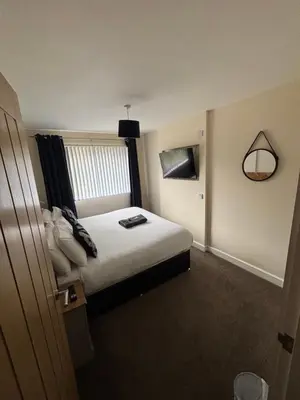 a hotel room with a bed and a window at Balnakeil house