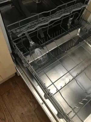 a dishwasher with a water bottle sitting in it at 2 new bold lawns leamington spa in Moffat