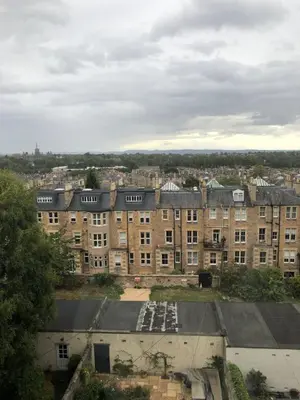 a large brick building with a lot of windows at Charming West End Flat in Edinburgh