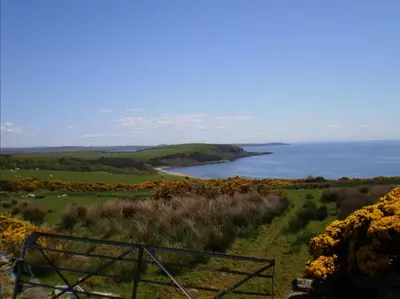 a view of a body of water from a hill at Skye Lodge in Tighnabruaich