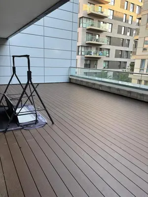 a chair on the roof of a building at One Bedroom Apartment in Greenwich Peninsula in Moffat
