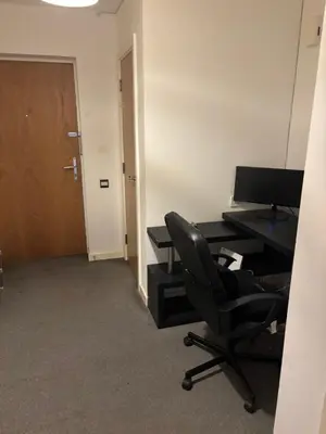 an office with a desk and a chair and a computer at One Bedroom Apartment in Greenwich Peninsula in Moffat