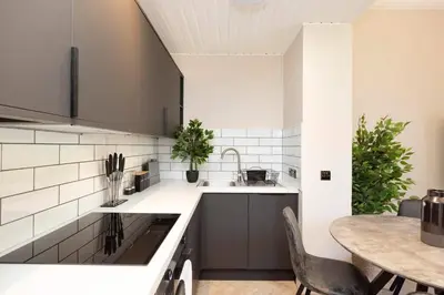 a kitchen with a sink and a table at 1 bed in heart of Old Town with Castle Views in Edinburgh