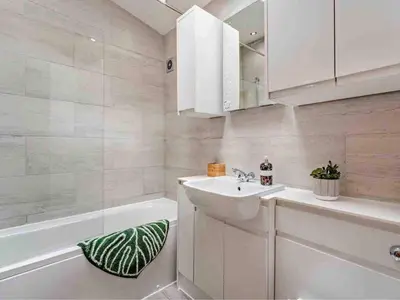 a bathroom with a sink and a tub and a mirror at Drovers Lodge, farm retreat in rural Lanarkshire, family and pet friendly, onsite craft distillery, perfect location for exploring central Scotland in Forth