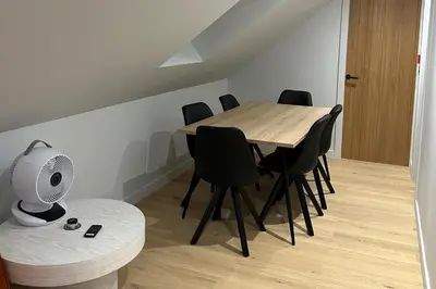 a dining room with a table and chairs and a fan at 2-Bed - Sleeps 6 - Pet Friendly with Free Parking in Falkirk