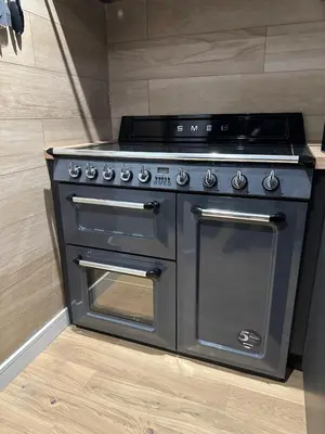 a stainless steel stove with two doors in a kitchen at 2-Bed - Sleeps 6 - Pet Friendly with Free Parking in Falkirk